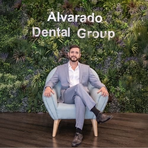 "Dr. Anas Najm, owner of Alvarado Dental Group, smiling confidently in a professional portrait."